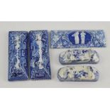 A group of four early nineteenth century blue and white transfer printed knife rests, circa 1810-30.