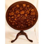A 19th Century Dutch mahogany and marquetry tilt top table, circular top with inlaid floral