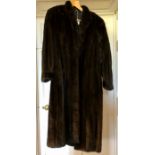 A blank ranch fur coat size 12 early 1980s. A small collar and sleeves that are gathered into the