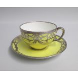 A Mintons late 19th century tea cup and saucer, yellow ground overlaid with an Art Nouveau and style