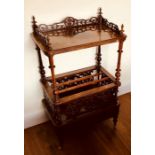 An early Victorian rosewood Canterbury whatnot, circa 1840, a pierced three quarter carved gallery