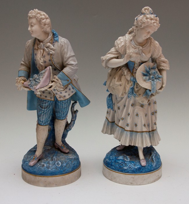 A pair of Continental figures, 19th Century, depicting and lady and gentleman, both holding head