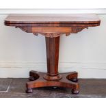 A William IV rosewood fold over card table, circa 1830, fold over top above carved frieze detail,