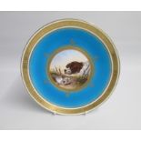 A Mintons Late 19th century Plate painted after Landseer with a Dog and a bird under a turquoise and