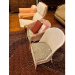 A Lloyd Loom chair, a further wicker chair, an early 20th Century upholstered armchair and a
