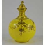 A Royal Crown Derby yellow ground scent bottle, circa 1910, with gilt foliage decoration, marked