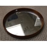 Uno & Osten Kristiansson, Luxus, a 20th Century Swedish teak mirror, of circular form, with a bent