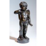 A bronze figure of a male cherub, 47cm high