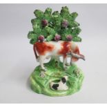 A Staffordshire Cow and Calf group Date: circa 1820-5 Size: 15.5cm high, 10cm diameter Condition: