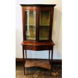 An Edwardian mahogany cabinet on stand, circa 1905, serpentine form with satinwood line inlaid,