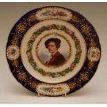 A mid-nineteenth century Sevres-style shaped circular porcelain plate, decorated with a portrait