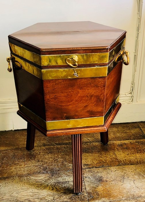 A George III mahogany and brass mounted Cellerate, circa 1780, hexagonal form, brass handles and