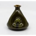 Christopher Dresser for Linthorpe Art Pottery, a conical and dimpled olive glaze vase, No. 57 with