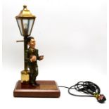 George Formby (1904-1961). Novelty table lamp modelled as George leaning on a lamp post, bearing
