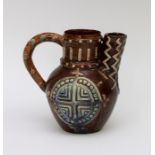 A late nineteenth century Castle Hedingham Pottery Art Pottery handle jug/teapot, circa 1880. It has