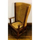 A 19th Century Orkney oak chair, oak joined with straw back flanked by open arm rest, raised on
