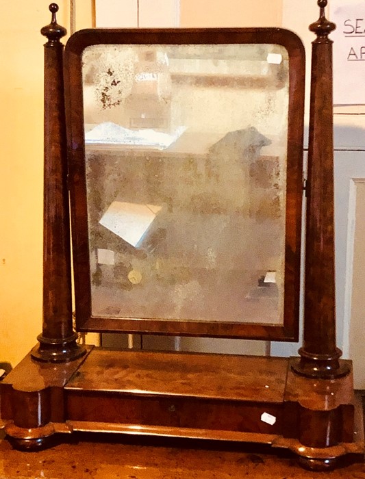 A Victorian flame mahogany toilet swing mirror, circa 1860, the rectangular plate with original