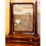 A Victorian flame mahogany toilet swing mirror, circa 1860, the rectangular plate with original