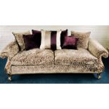 A recent Duresta double settee, silvered scroll frames in the Rococo style, fully upholstered deep