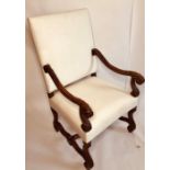 A Louis XIV revival French oak armchair, padded rectangular back untied with scrolled carved arms,