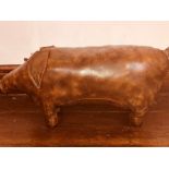 An Arts & Crafts tan leather stool in the form of a pig Note: it is believed these type of stools