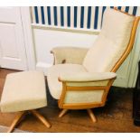 An Ercol elm reclining cream upholstered swivelling chair and matching footstool (2)