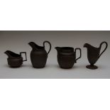 A group of late eighteenth, early nineteenth century black basalt jugs, circa 1790-1810. To