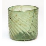 A green glass beaker, German, circa 1450-1500 Condition: professionally restored Note: for a similar