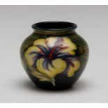 A Moorcroft small hibiscus vase, Queen Mary paper label, height 7cm