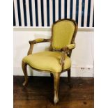 A Victorian style stained oak framed chair, later upholstered, oval back united with arms, raised on