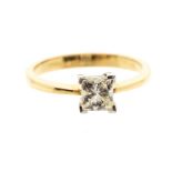 A princess cut diamond and 18ct yellow gold solitaire ring, the claw set diamond weighing approx.
