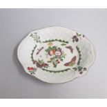A Chelsea Red Anchor Oval Dish with basket weave moulding painted with cut fruit and butterflies