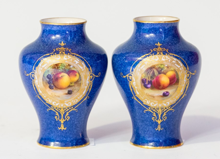 A pair of Royal Worcester vases, early 20th Century, of inverted baluster form, each with still life