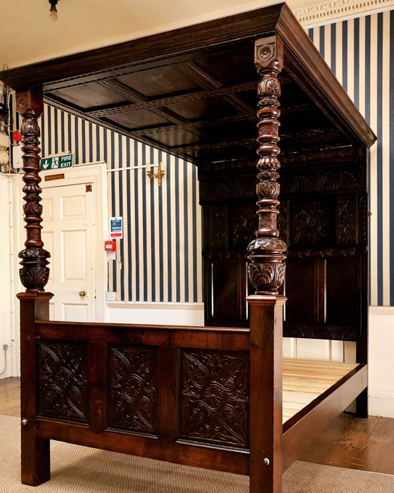 A Charles II oak four poster bed, circa 1670, moulded rectangular cornice with twelve panel roof,