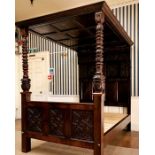 A Charles II oak four poster bed, circa 1670, moulded rectangular cornice with twelve panel roof,