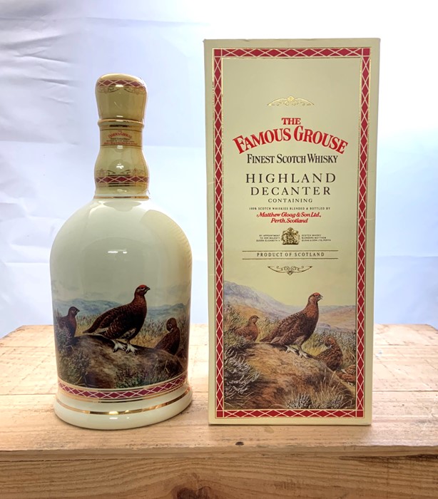 A bottle of Famous Grouse Scotch Blended Whisky in The Famous Grouse Highland Decanter by Wade.