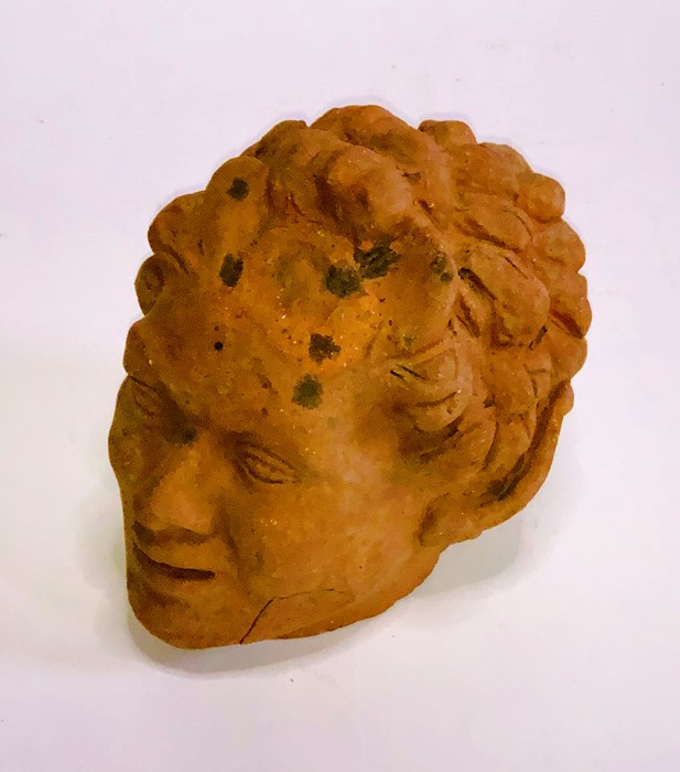 A 19th Century Italian terracotta bust of a Roman man