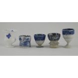A group of five early nineteenth century blue and white transfer printed egg cups, circa 1810-40.