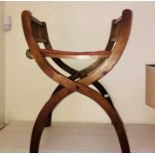 An early 19th century oak stool, rectangular seat on trestle type supports and stretcher.