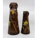 Two Bretby art pottery bronzed tapered vases with triple-ring handles and applied insects on