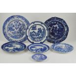 A collection of seven early nineteenth century blue and white transfer printed Spode plates all