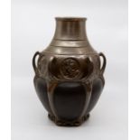 A Bretby art pottery bronzed Art Nouveau multi-handled baluster vase, the frieze with circular