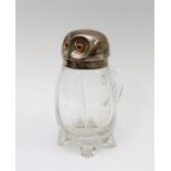 A late Victorian novelty glass claret jug in the form of an owl, the silver hinged cover as the