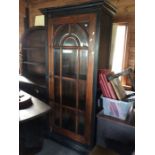 A reproduction glazed bookcase, with bevelled edge glass