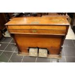 A mid Victorian mahogany cased Harmonium, with two pedals, five octaves, the case bearing a
