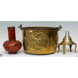 A traditional brass coal hod with repousse design to the frieze, iron bale handle, a pair of brass