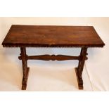 A 17th Century Spanish walnut and oak trestle table, rectangular top with dentil carved edge,
