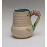 A Clarice Cliff jug, moulded floral branch handle, printed Newport Pottery mark, No.811, height