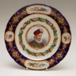 A mid-nineteenth century Sevres-style shaped circular porcelain plate, decorated with a portrait