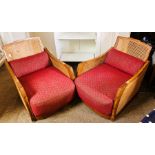 A pair of Art Deco Bergere style low armchairs, cane back and sides, with upholster drop in seats